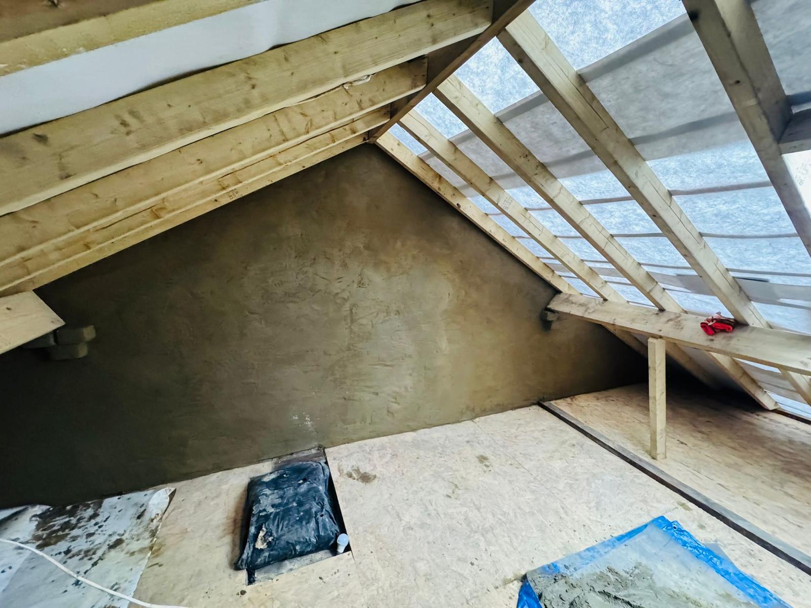 Loft conversion interior with timber framing by Apex UK Roofing